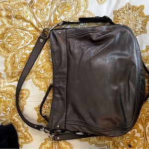 Coach shoulder bag with longer crossbody strap.